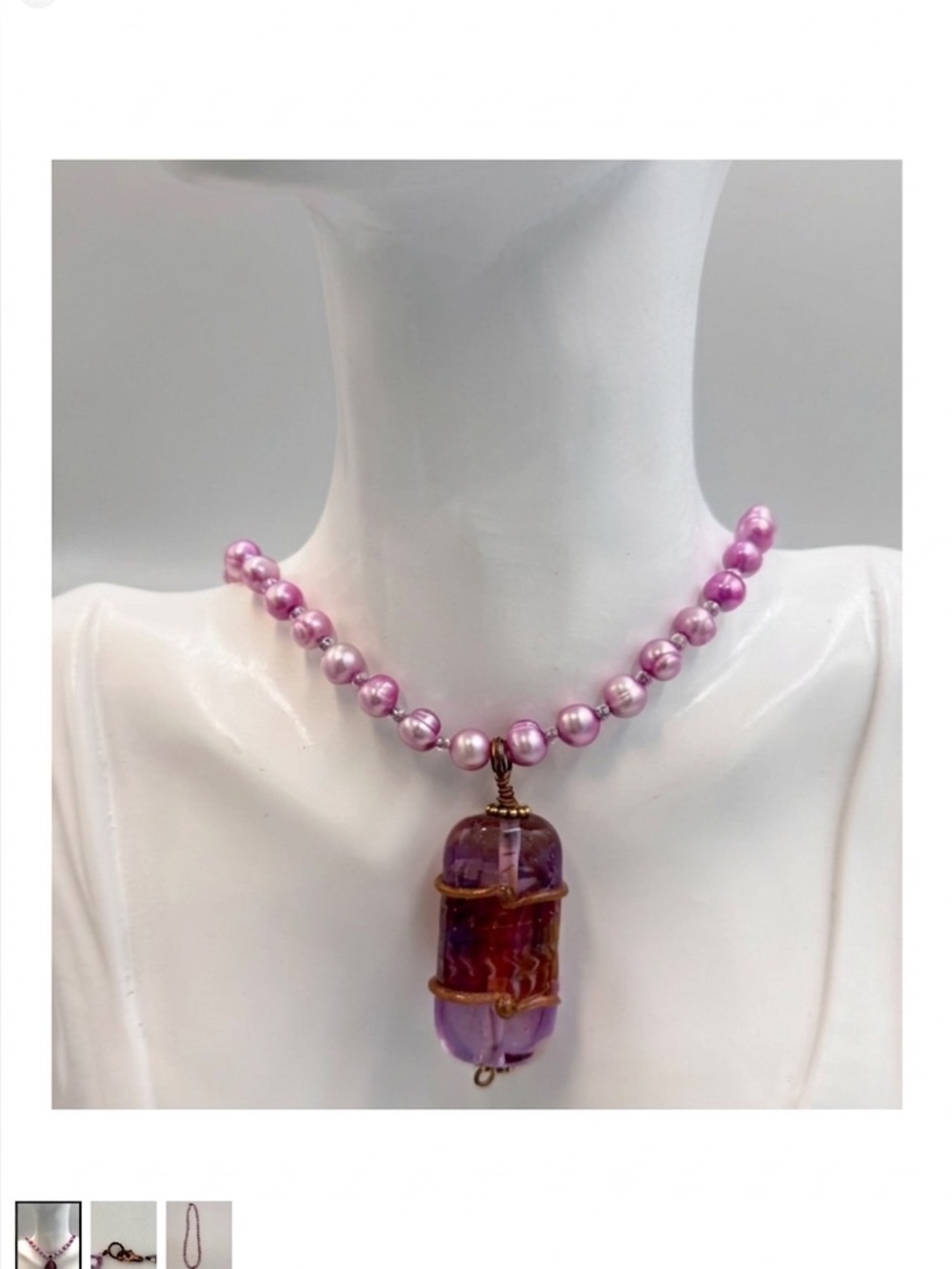 A statement necklace featuring an ovoid purple glass pendant 2268